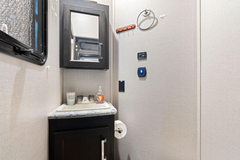 325 Calusa Street, Unit 351 Key Largo, FL 33037 - Photo 17 of 18 a bathroom with a sink and a mirror