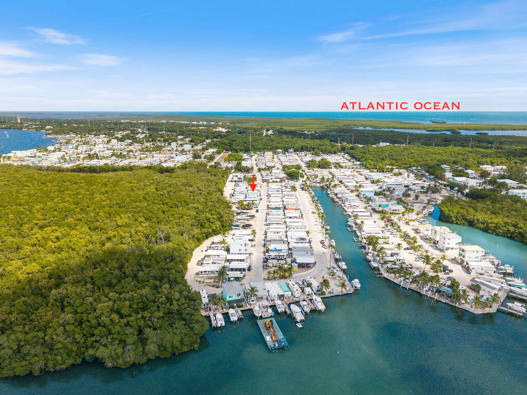 325 Calusa Street, Unit 351 Key Largo, FL 33037 - Photo 4 of 18 a view of a terrace with lawn chairs