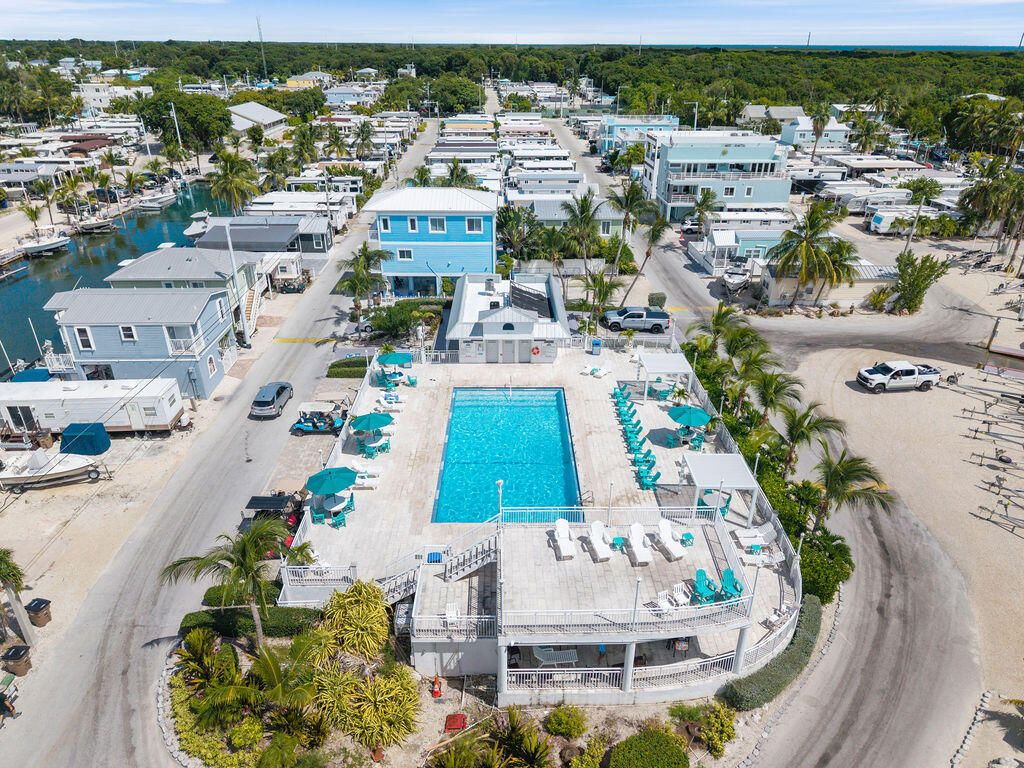 325 Calusa Street, Unit 351 Key Largo, FL 33037 - Photo 8 of 18 an aerial view of a swimming pool with outdoor seating
