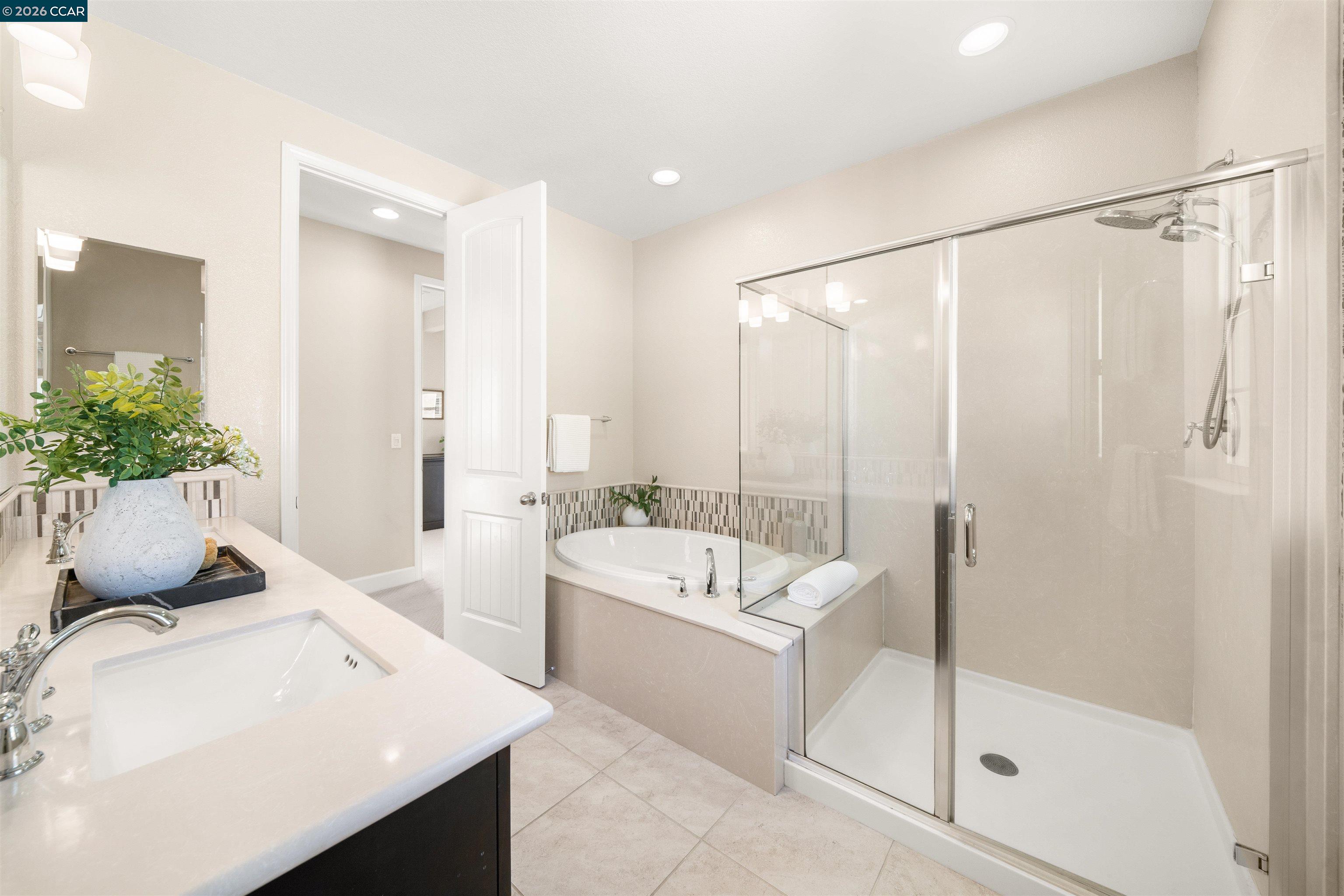 2026 Poinsettia Street San Ramon, CA 94582 - Photo 15 of 26 a bathroom with a tub sink and mirror