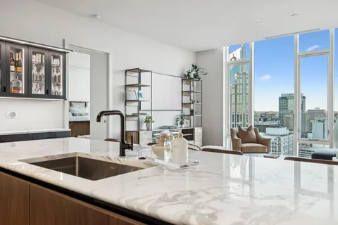 a view of kitchen with wooden floor and windows