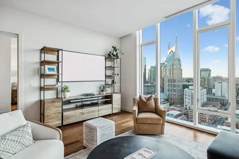 a bedroom with a bed and with flat screen tv