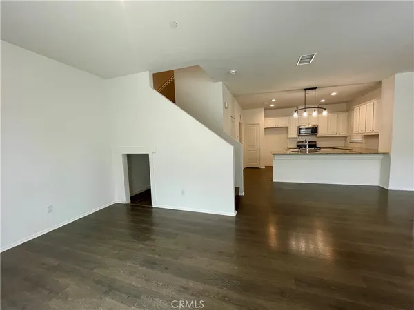 a view of a kitchen with a sink and cabinets