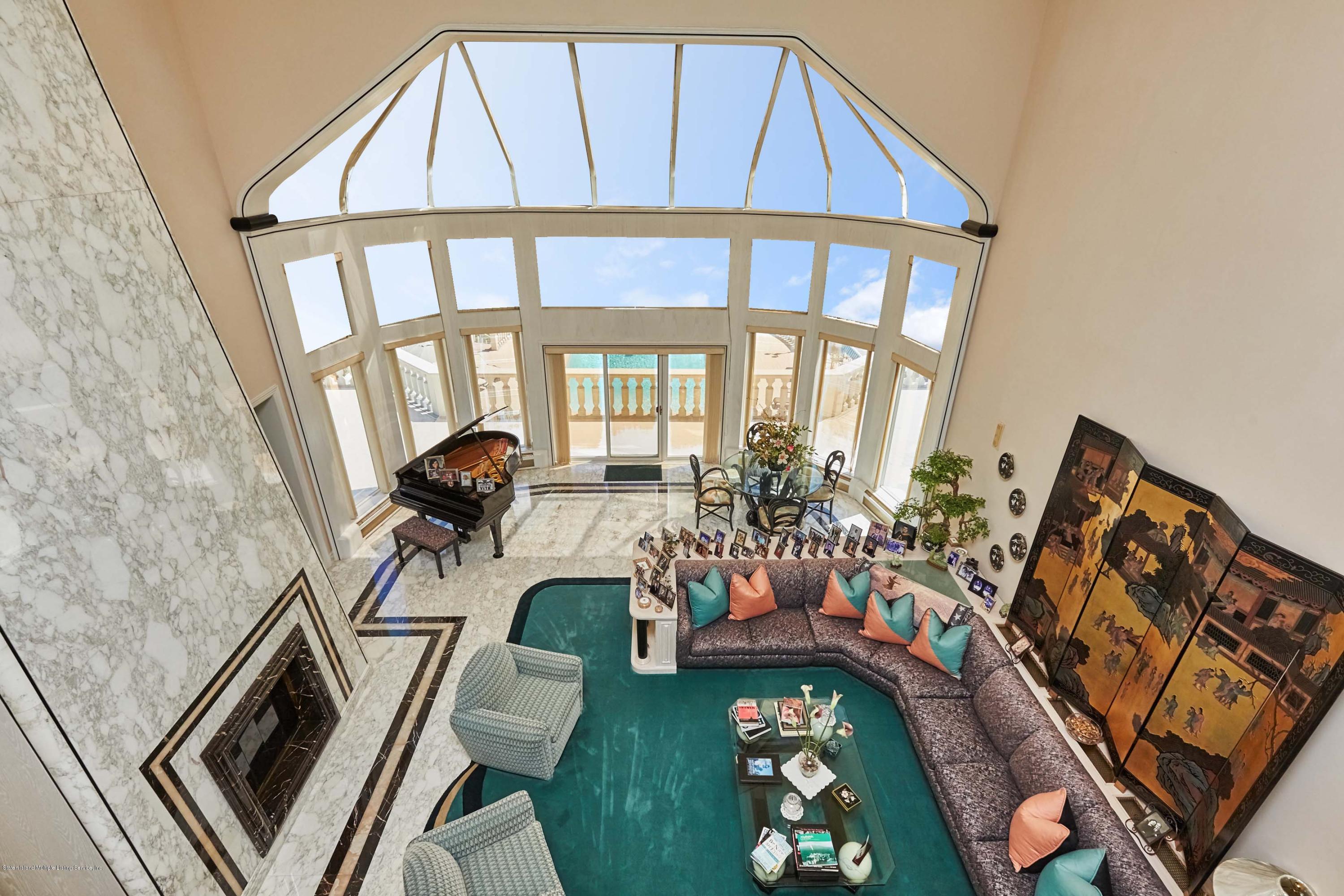 95 Circle Road Staten Island, NY 10304 - Photo 11 of 42 a view of a livingroom with furniture and a fireplace