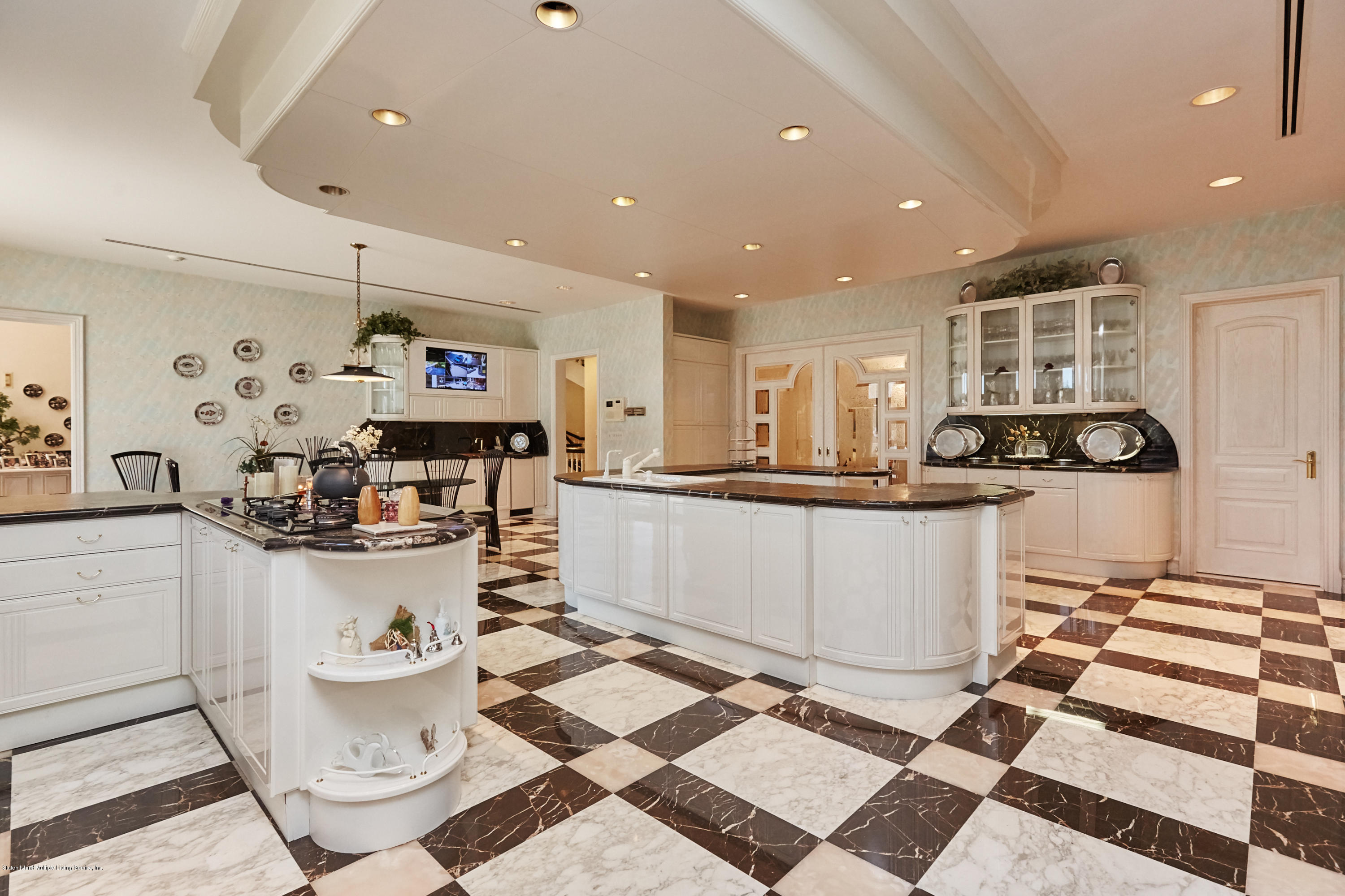 95 Circle Road Staten Island, NY 10304 - Photo 15 of 42 a kitchen with a sink and white cabinets