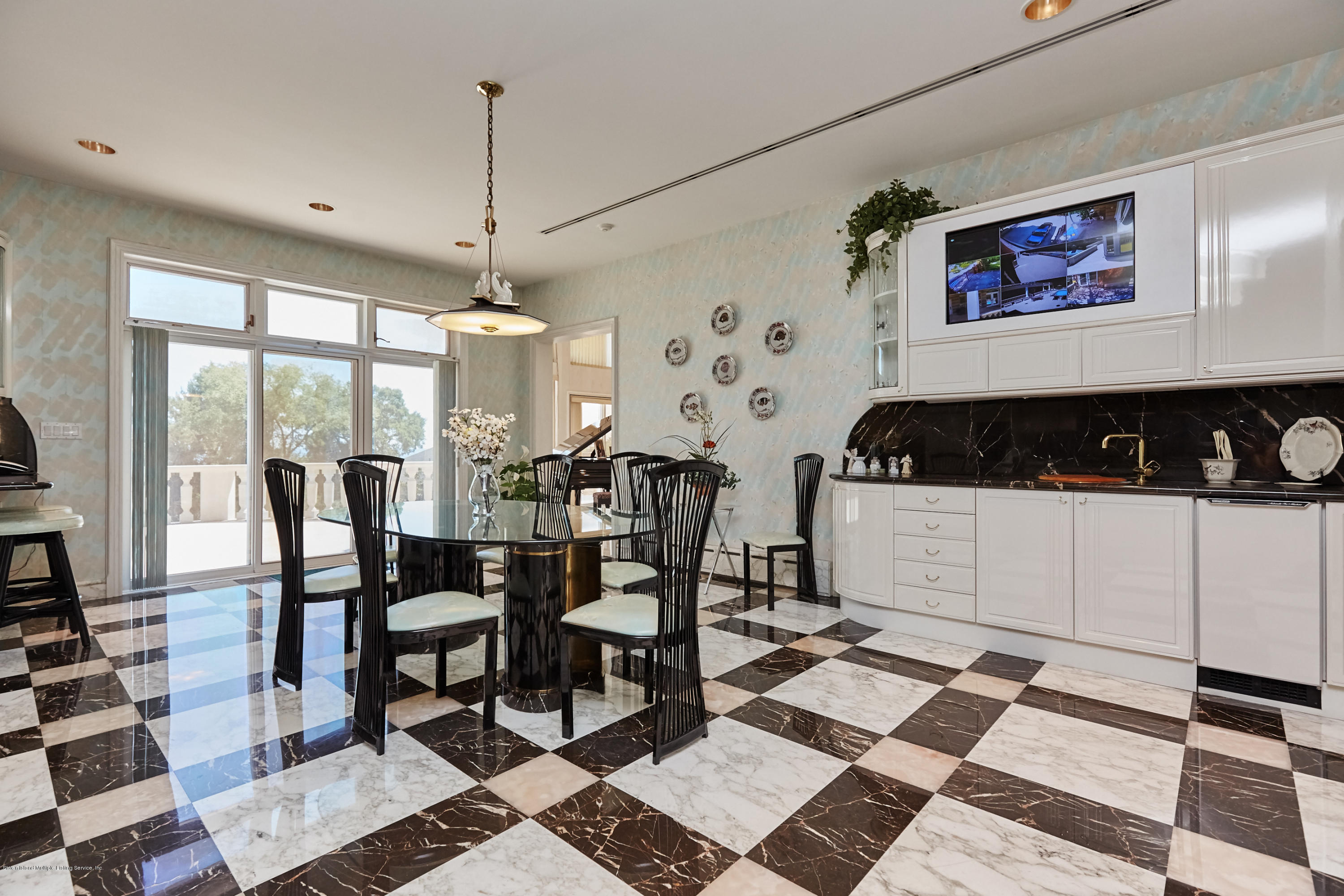 95 Circle Road Staten Island, NY 10304 - Photo 18 of 42 a table and chairs in a room