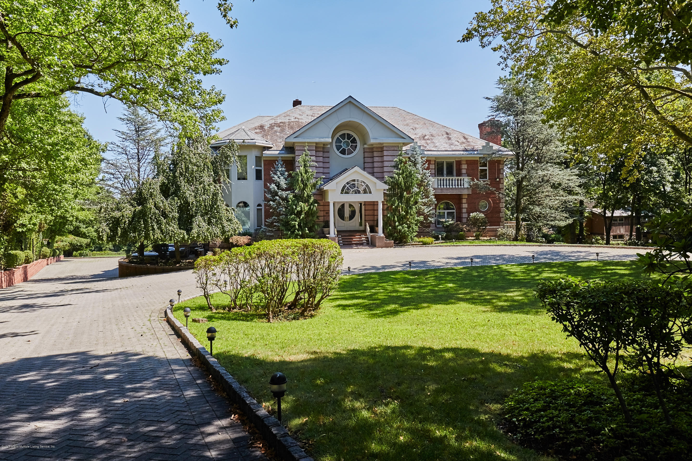 95 Circle Road Staten Island, NY 10304 - Photo 2 of 42 a front view of a house with a yard