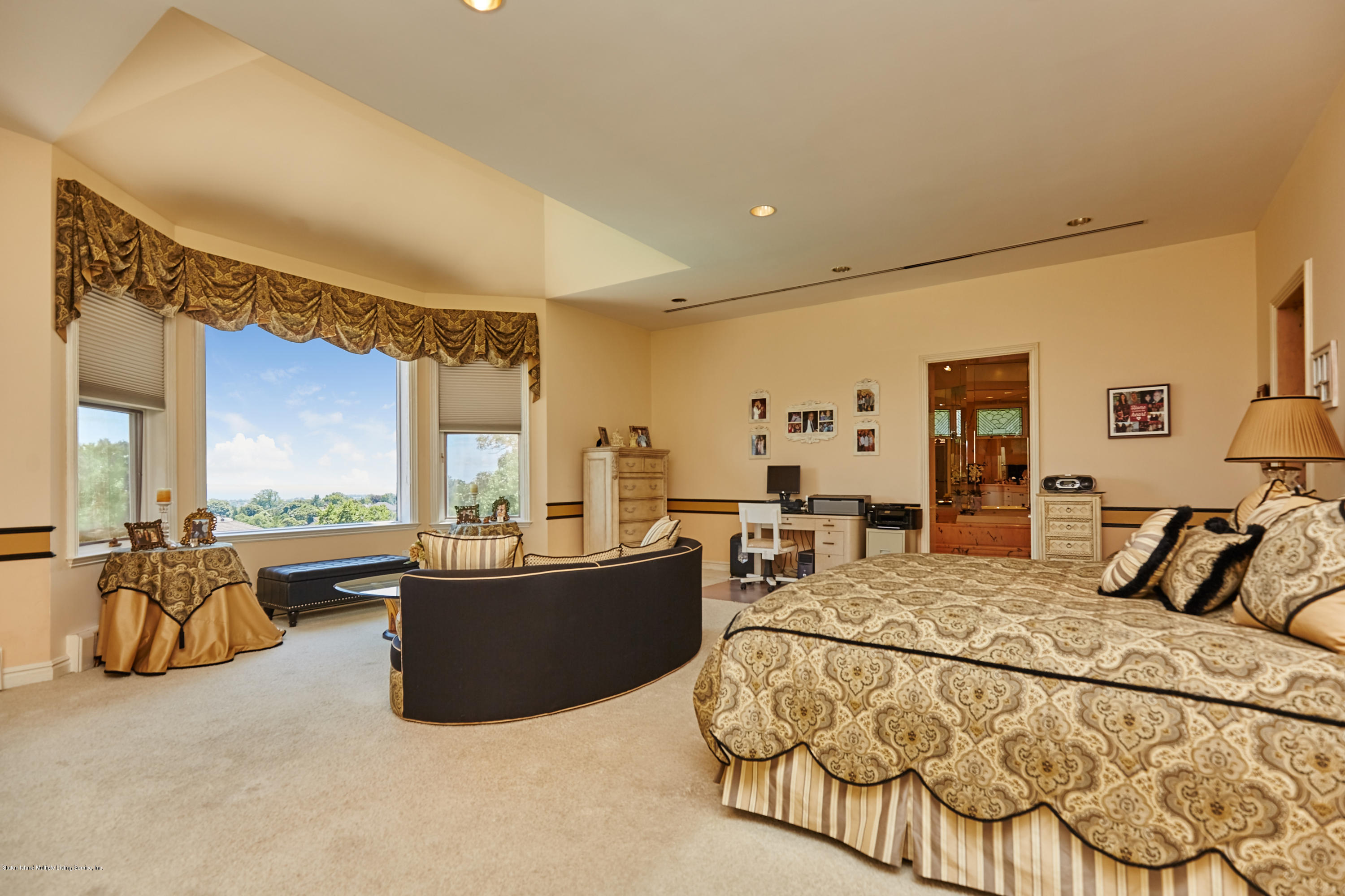 95 Circle Road Staten Island, NY 10304 - Photo 23 of 42 a bedroom with furniture and large windows
