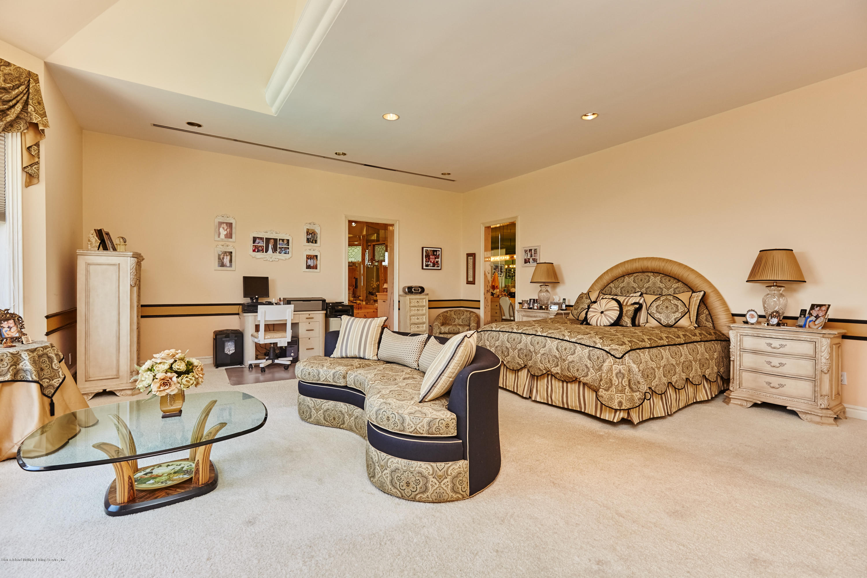 95 Circle Road Staten Island, NY 10304 - Photo 24 of 42 a spacious bedroom with bed and a large mirror