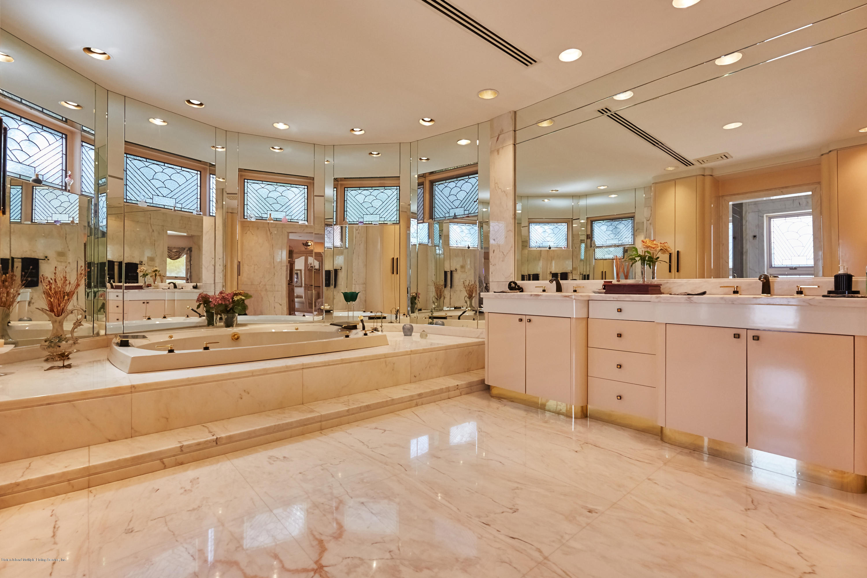 95 Circle Road Staten Island, NY 10304 - Photo 26 of 42 a large white kitchen with a large window and double vanity