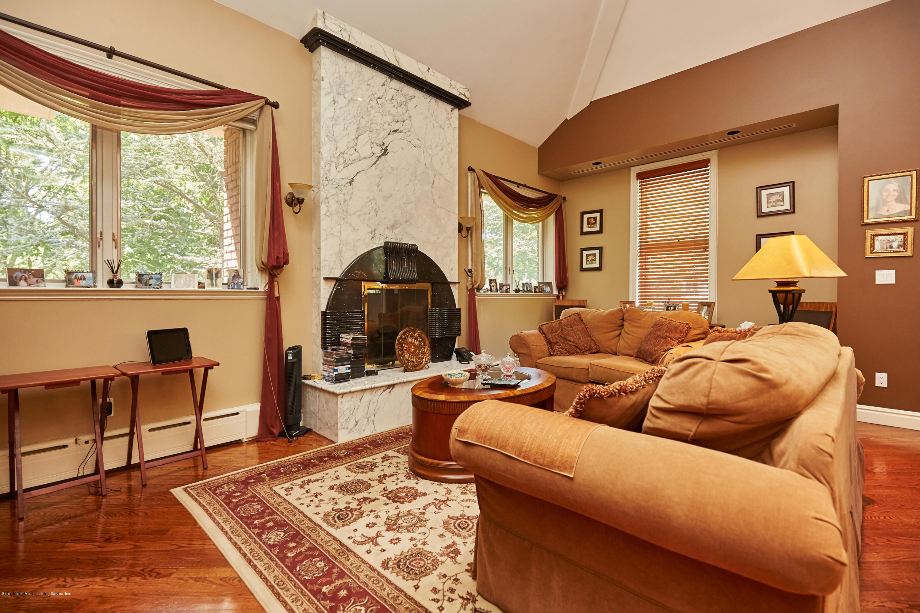 95 Circle Road Staten Island, NY 10304 - Photo 28 of 42 a living room with furniture and a table