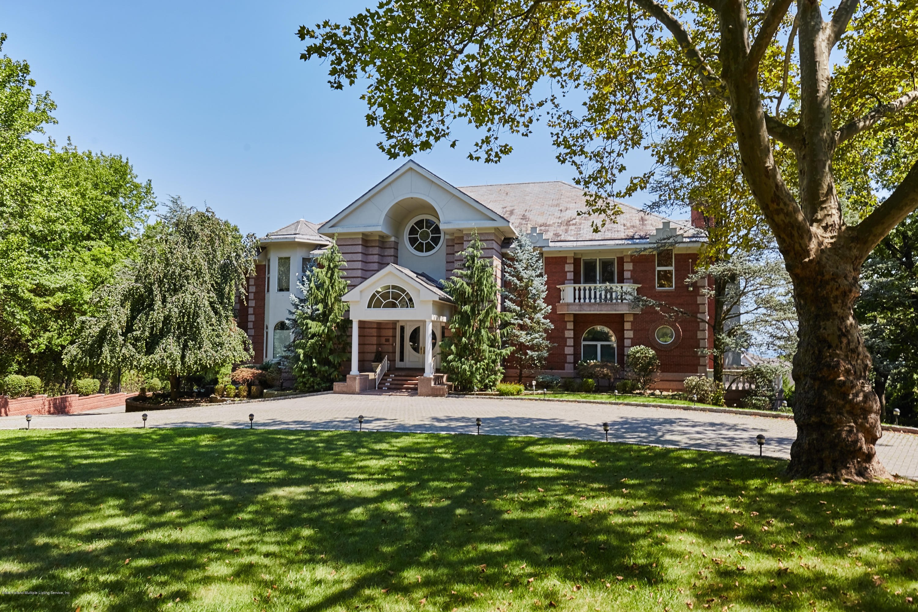 95 Circle Road Staten Island, NY 10304 - Photo 3 of 42 a front view of a house with a yard