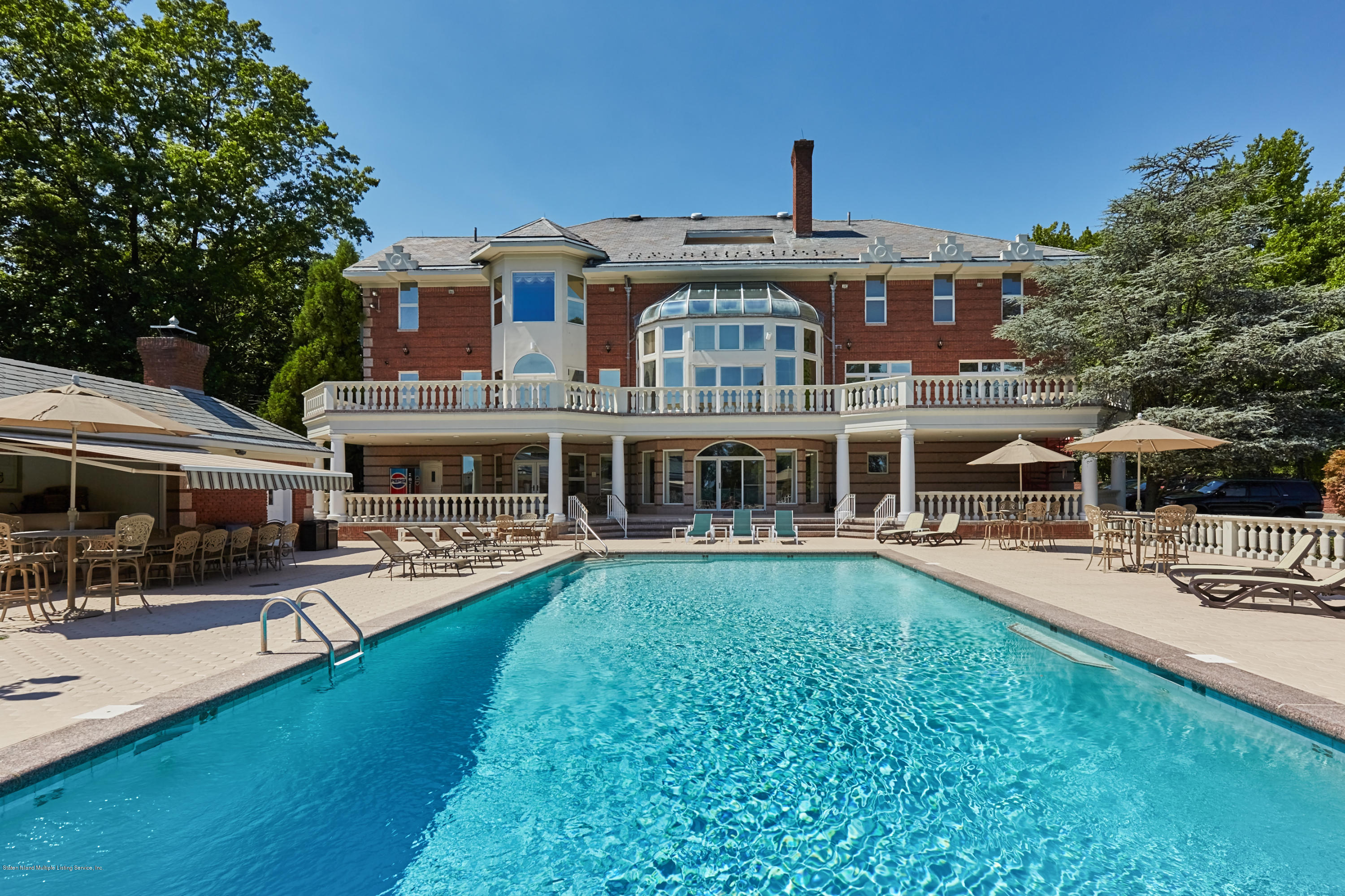 95 Circle Road Staten Island, NY 10304 - Photo 35 of 42 a front view of a building with swimming pool