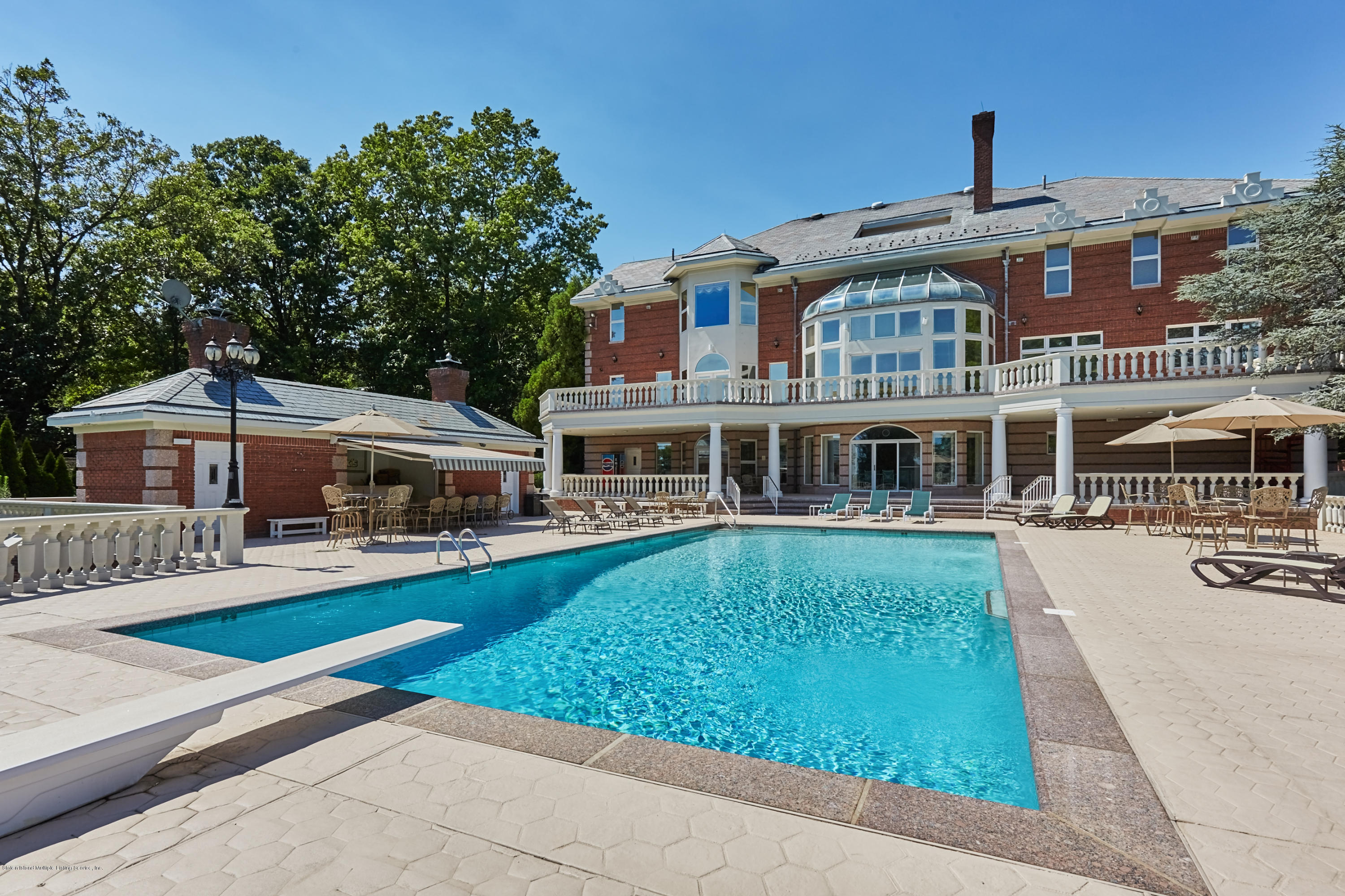 95 Circle Road Staten Island, NY 10304 - Photo 36 of 42 a front view of a house with swimming pool having outdoor seating