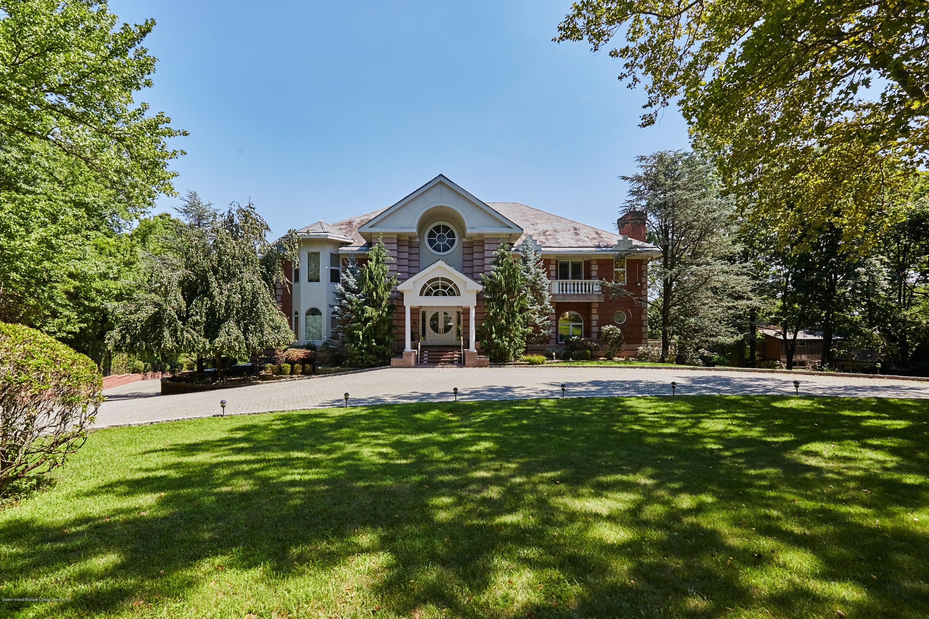 95 Circle Road Staten Island, NY 10304 - Photo 4 of 42 a front view of a house with a garden