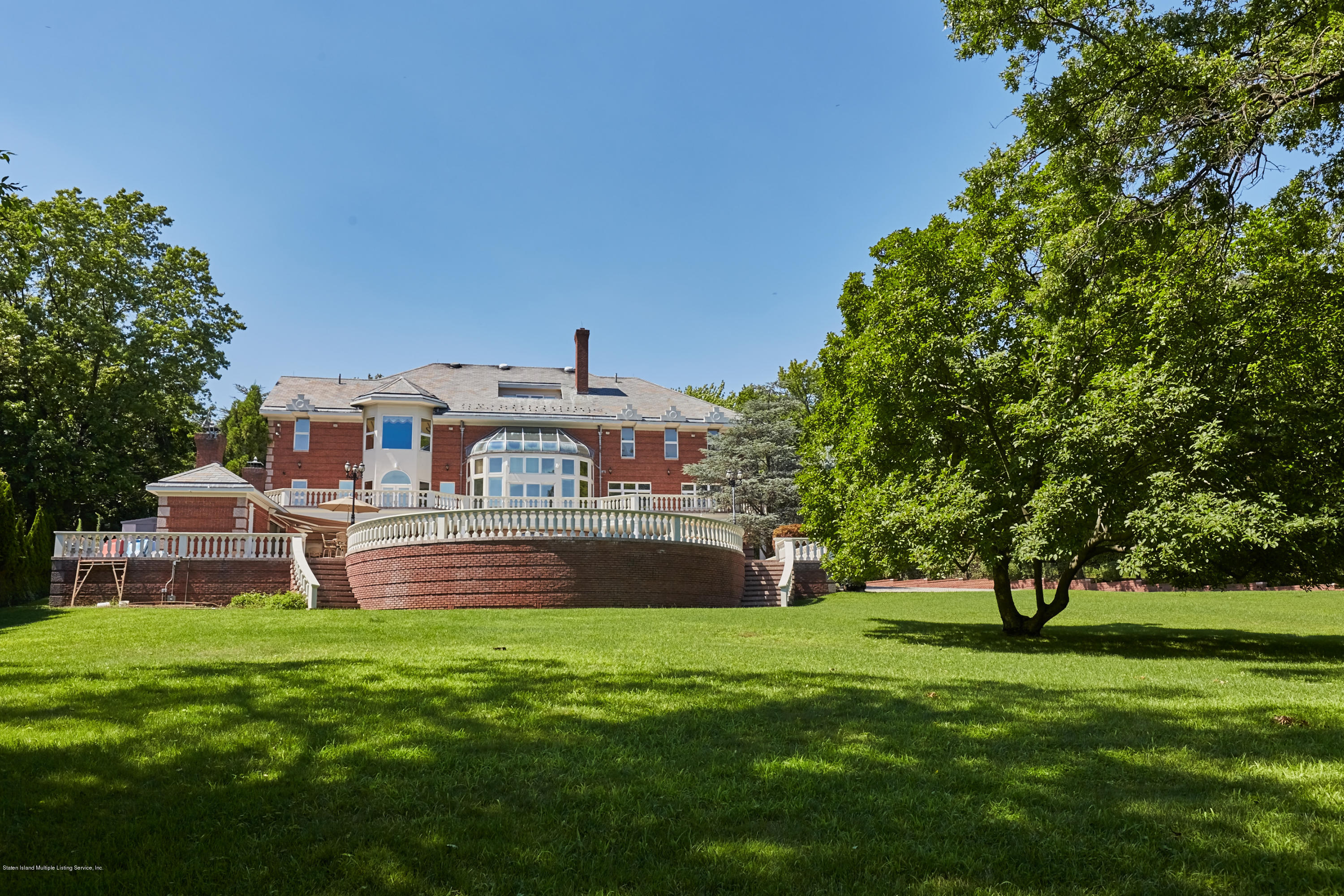 95 Circle Road Staten Island, NY 10304 - Photo 41 of 42 a front view of a house with garden and trees