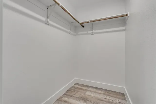 a view of an empty walk in closet