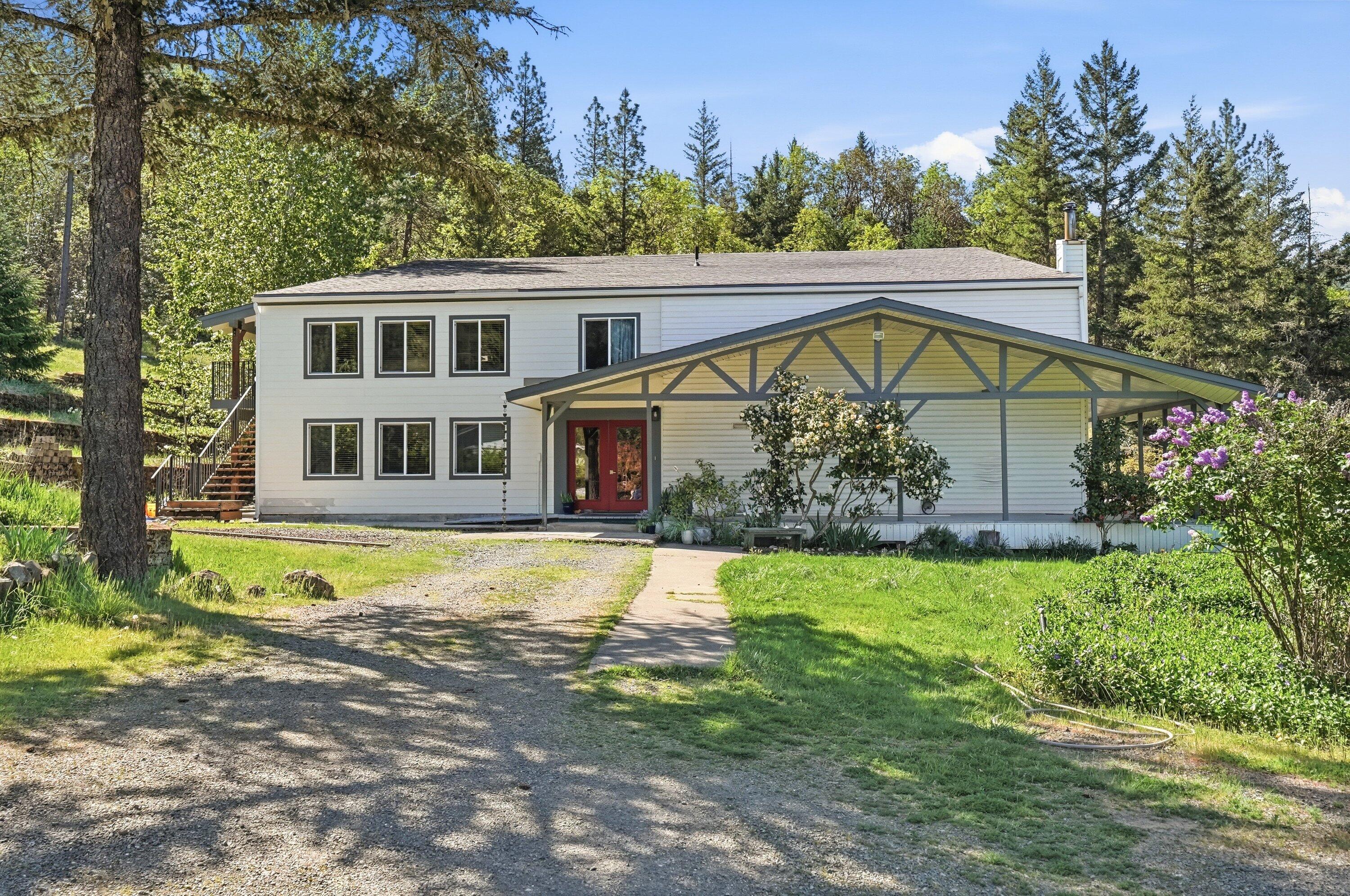 a house with trees in the background