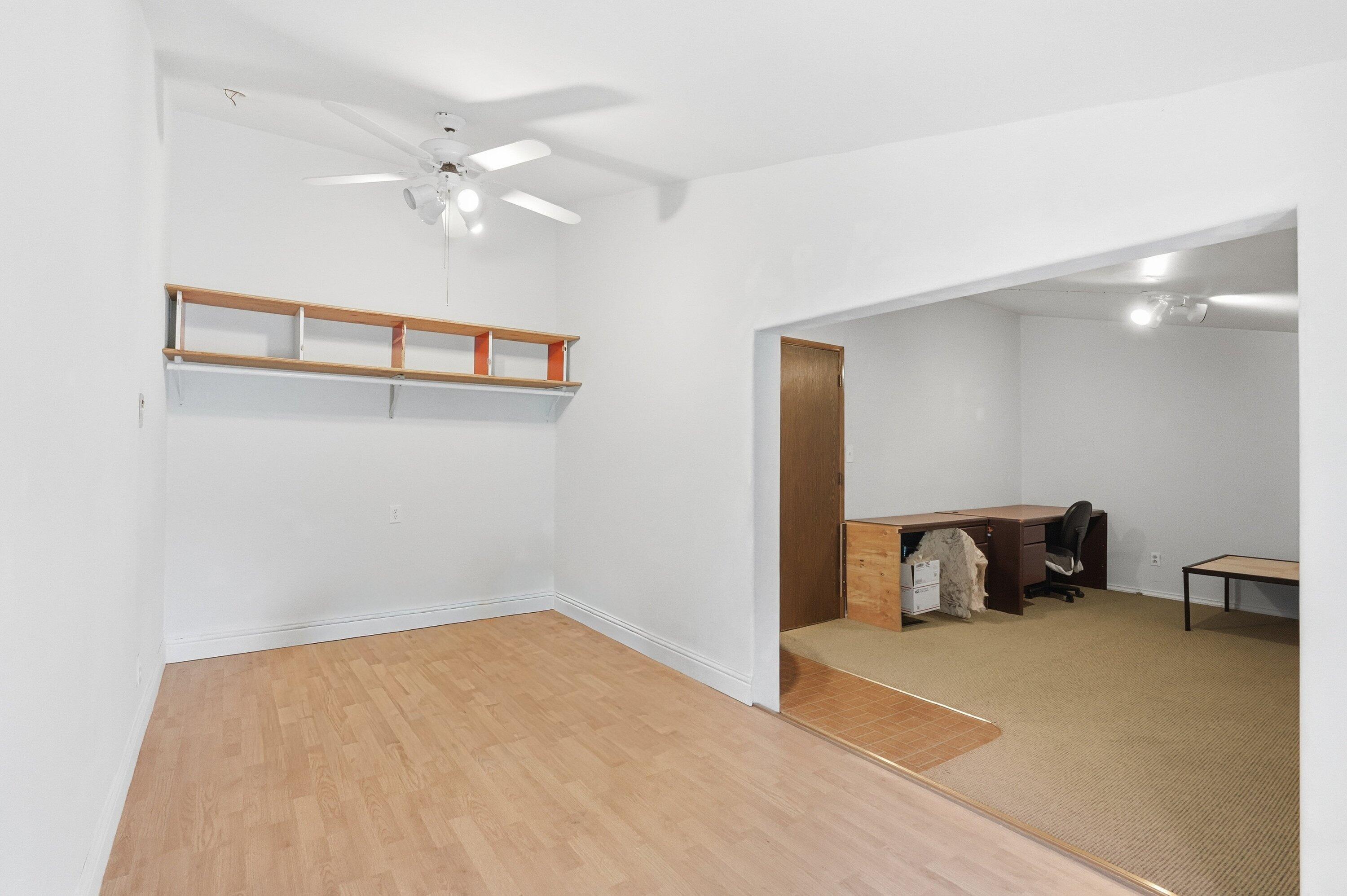 827 Summit Loop Grants Pass, OR 97527 - Photo 14 of 32 a bedroom with a bed and wooden floor