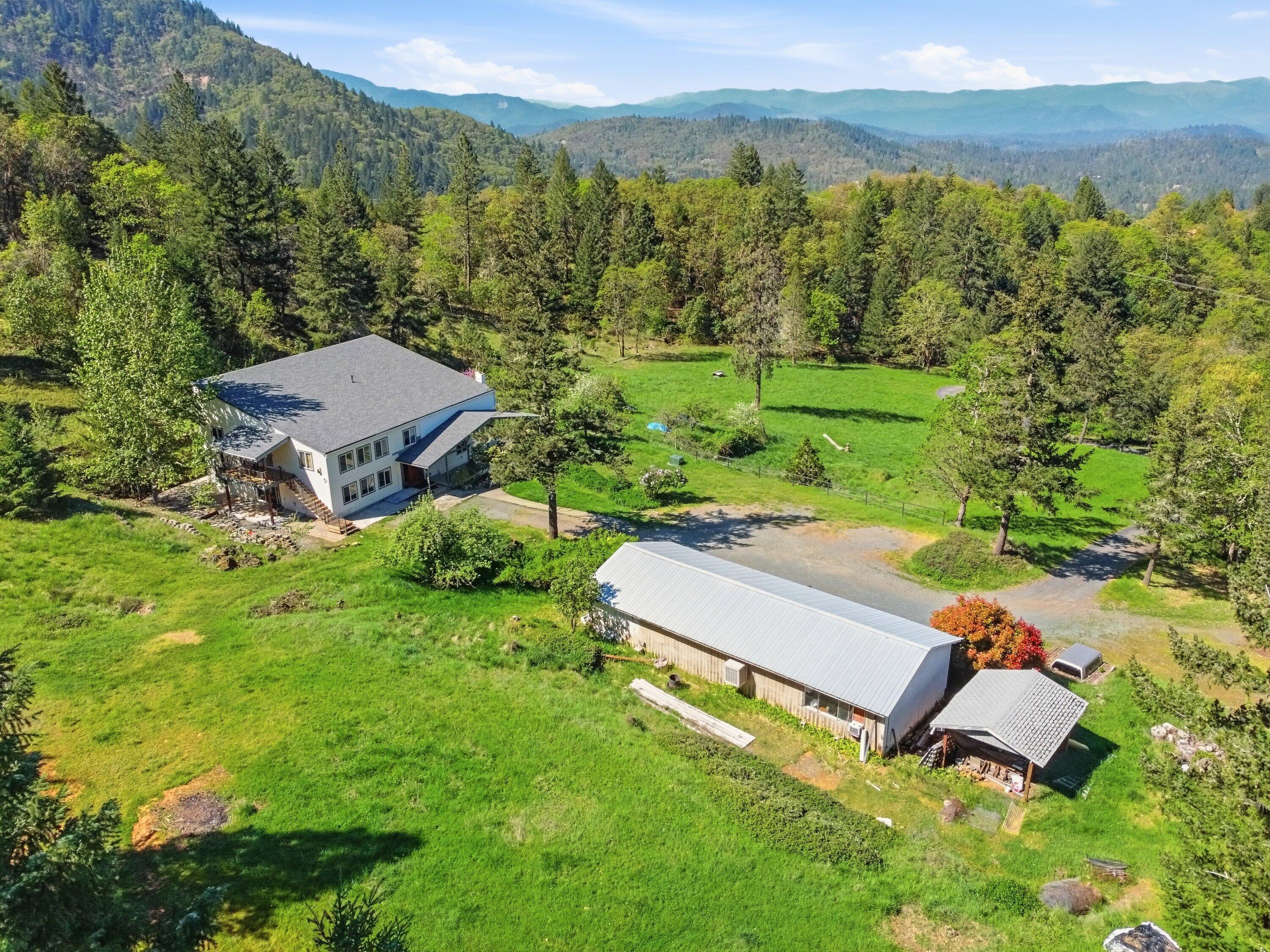 827 Summit Loop Grants Pass, OR 97527 - Photo 26 of 32 an aerial view of a house with garden