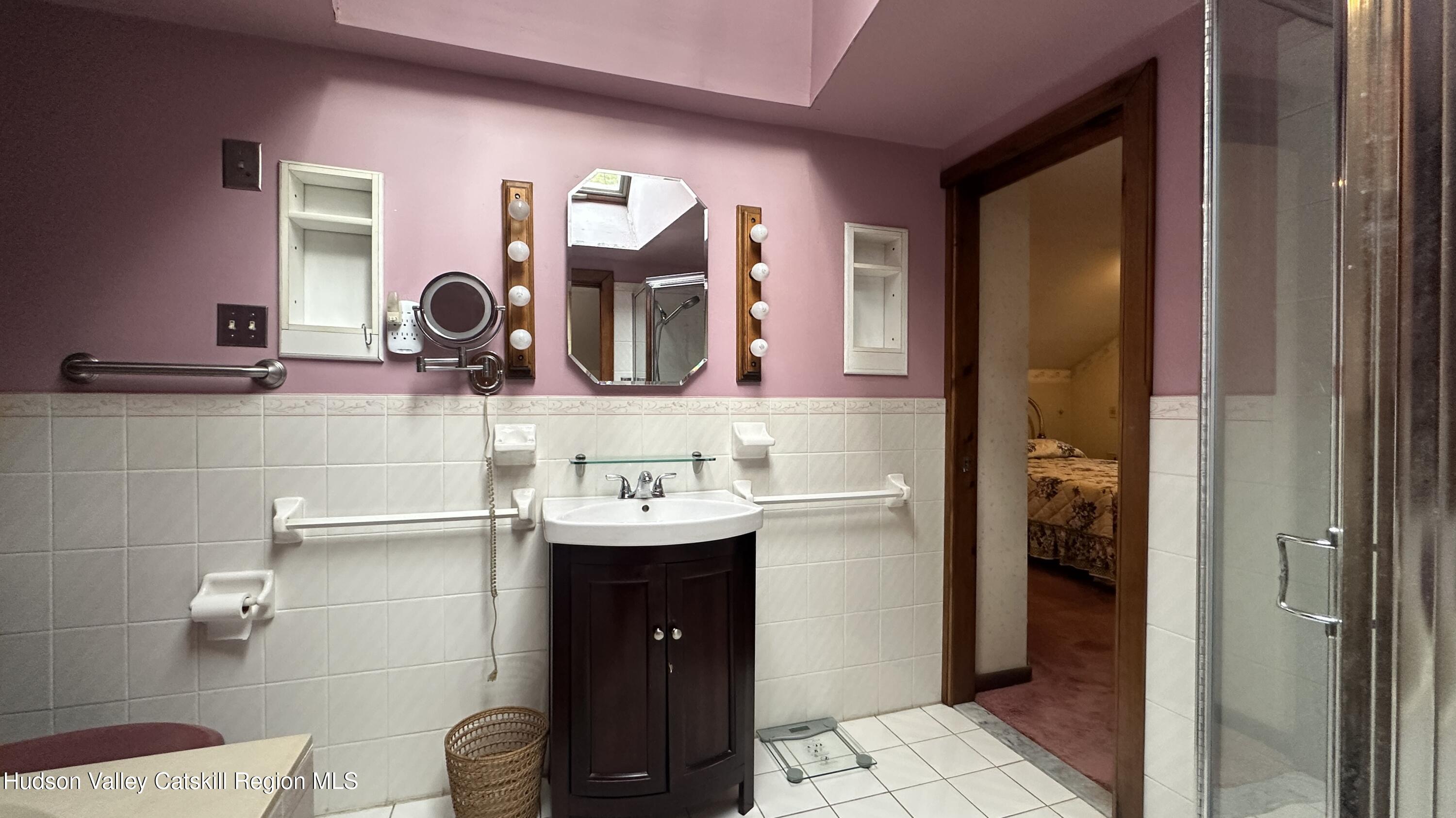 7 River Road, Unit TOWN ROAD Highland, NY 12528 - Photo 15 of 25 a bathroom with a sink a toilet and mirror