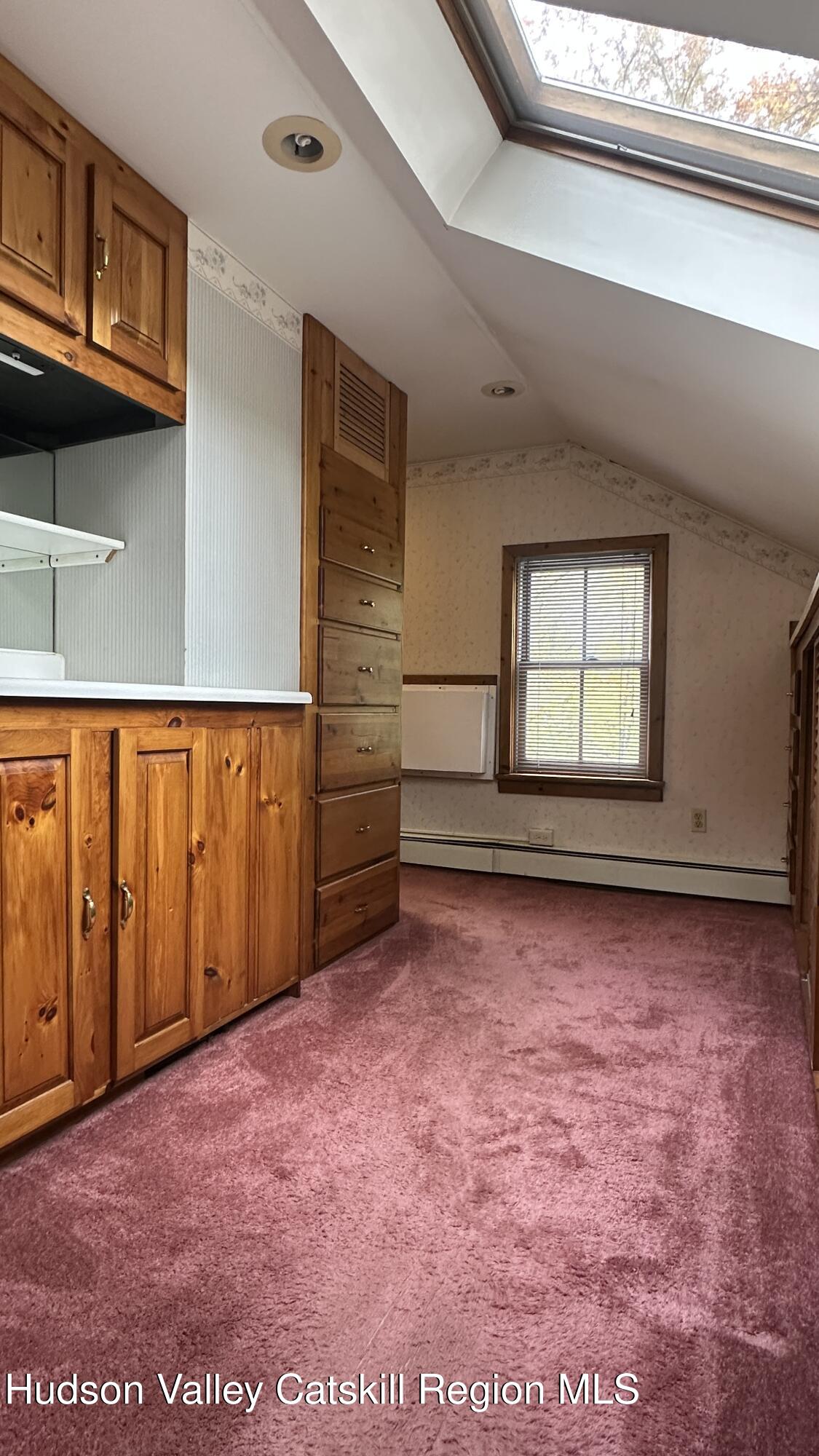 7 River Road, Unit TOWN ROAD Highland, NY 12528 - Photo 18 of 25 a view of a livingroom with an empty space and wooden floor