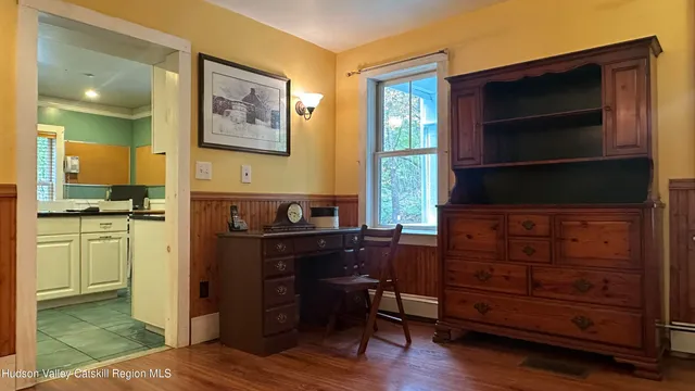 a kitchen with a refrigerator and a stove top oven
