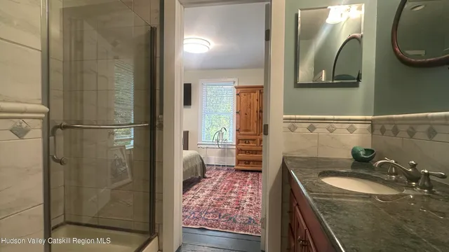 a bathroom with a sink and a mirror