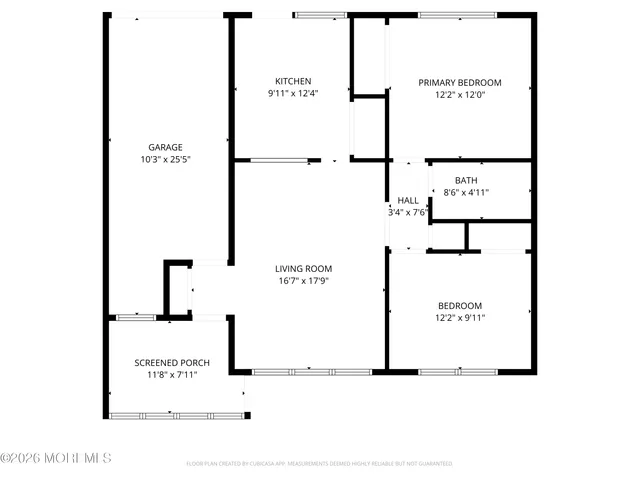 a front view of a house with a big yard and potted plants
