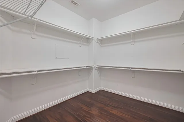 a view of an empty walk in closet