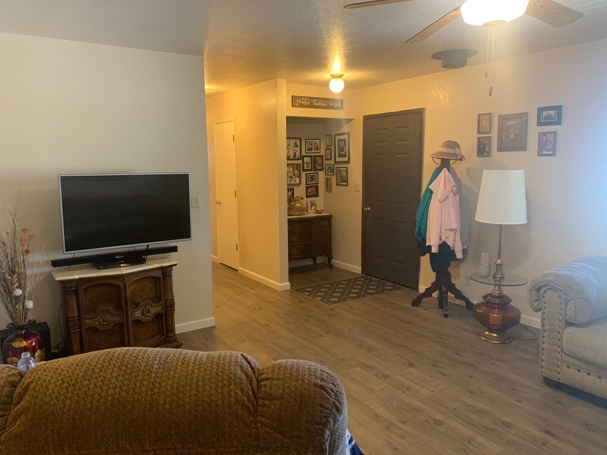 20604 Roff Way Burney, CA 96013 - Photo 14 of 32 a bedroom with a bed and a flat screen tv