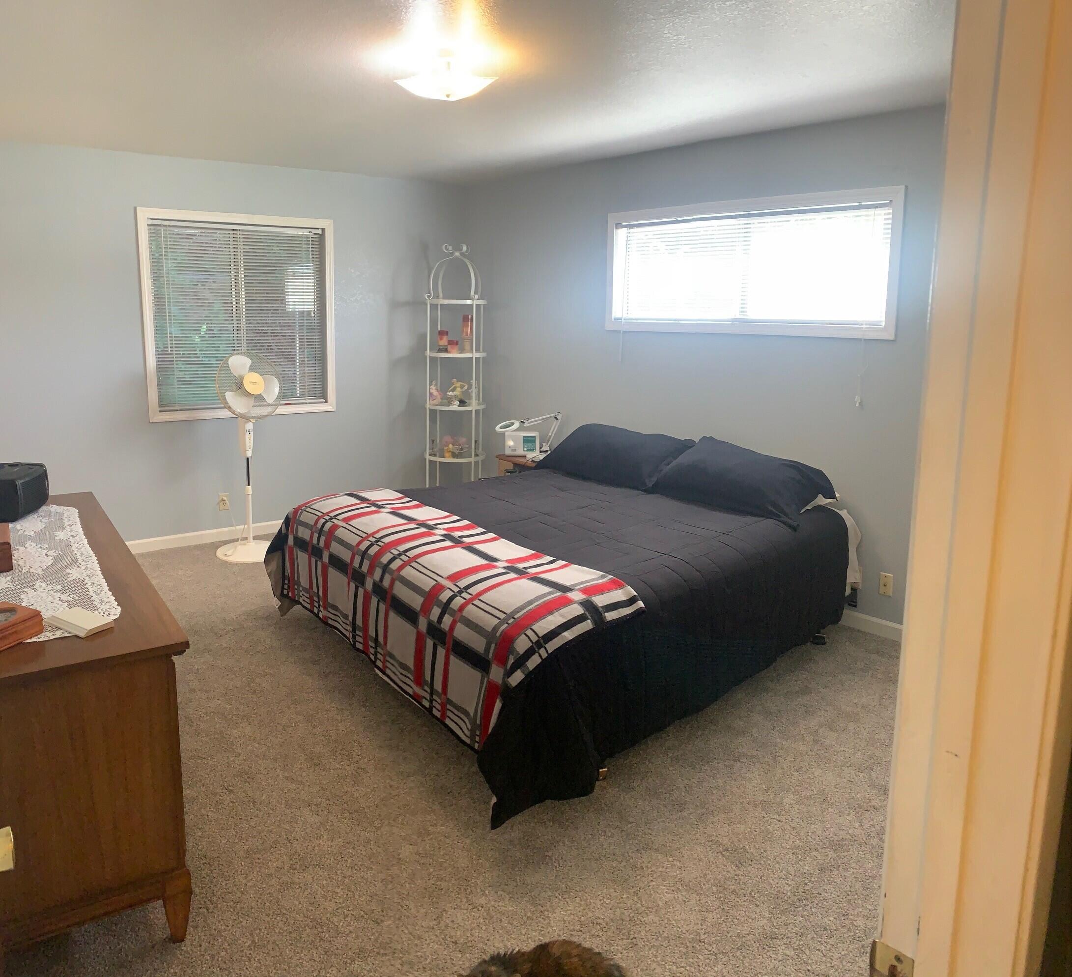 20604 Roff Way Burney, CA 96013 - Photo 21 of 32 a bedroom with a bed and window