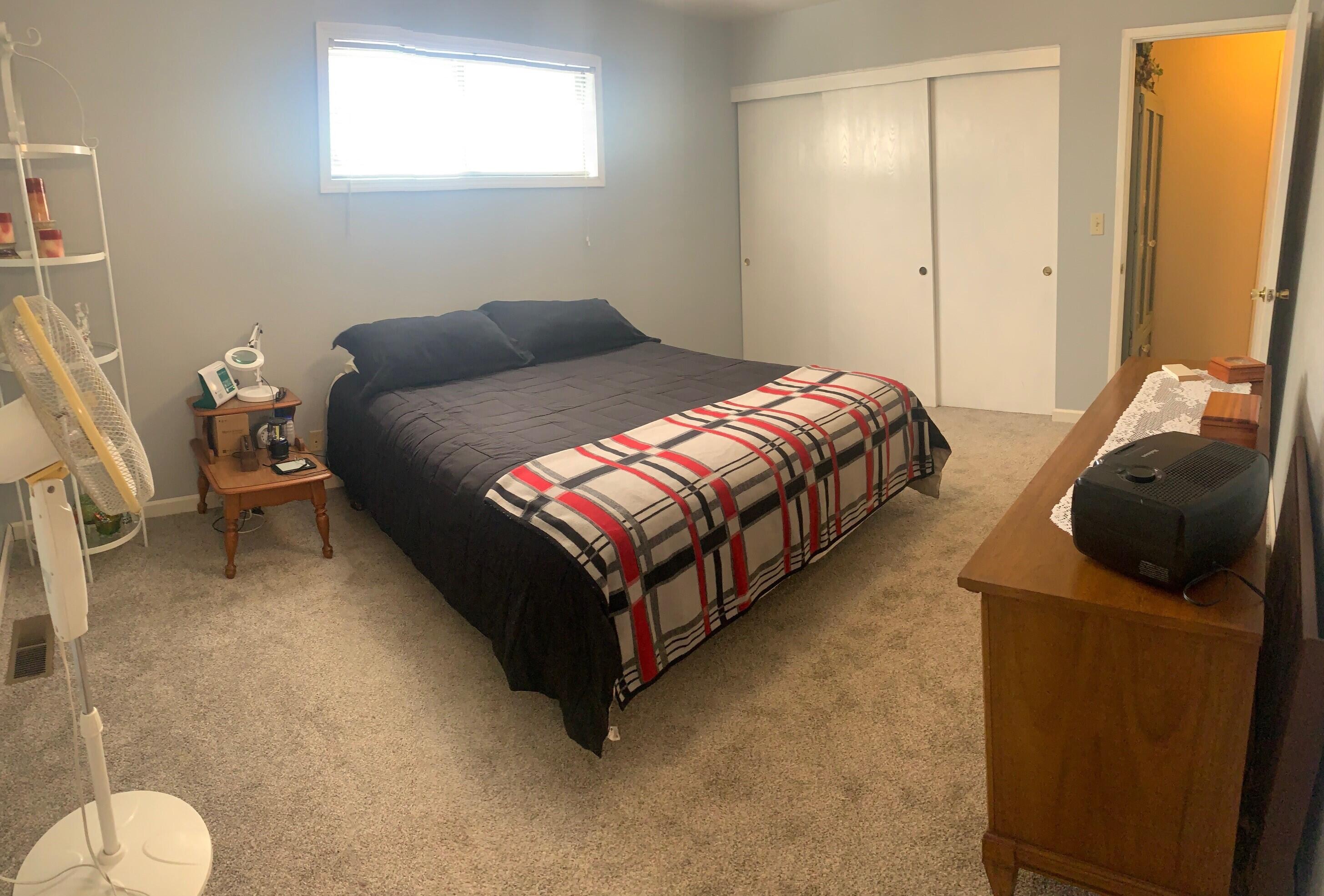 20604 Roff Way Burney, CA 96013 - Photo 22 of 32 a bedroom with a bed and dresser with mirror