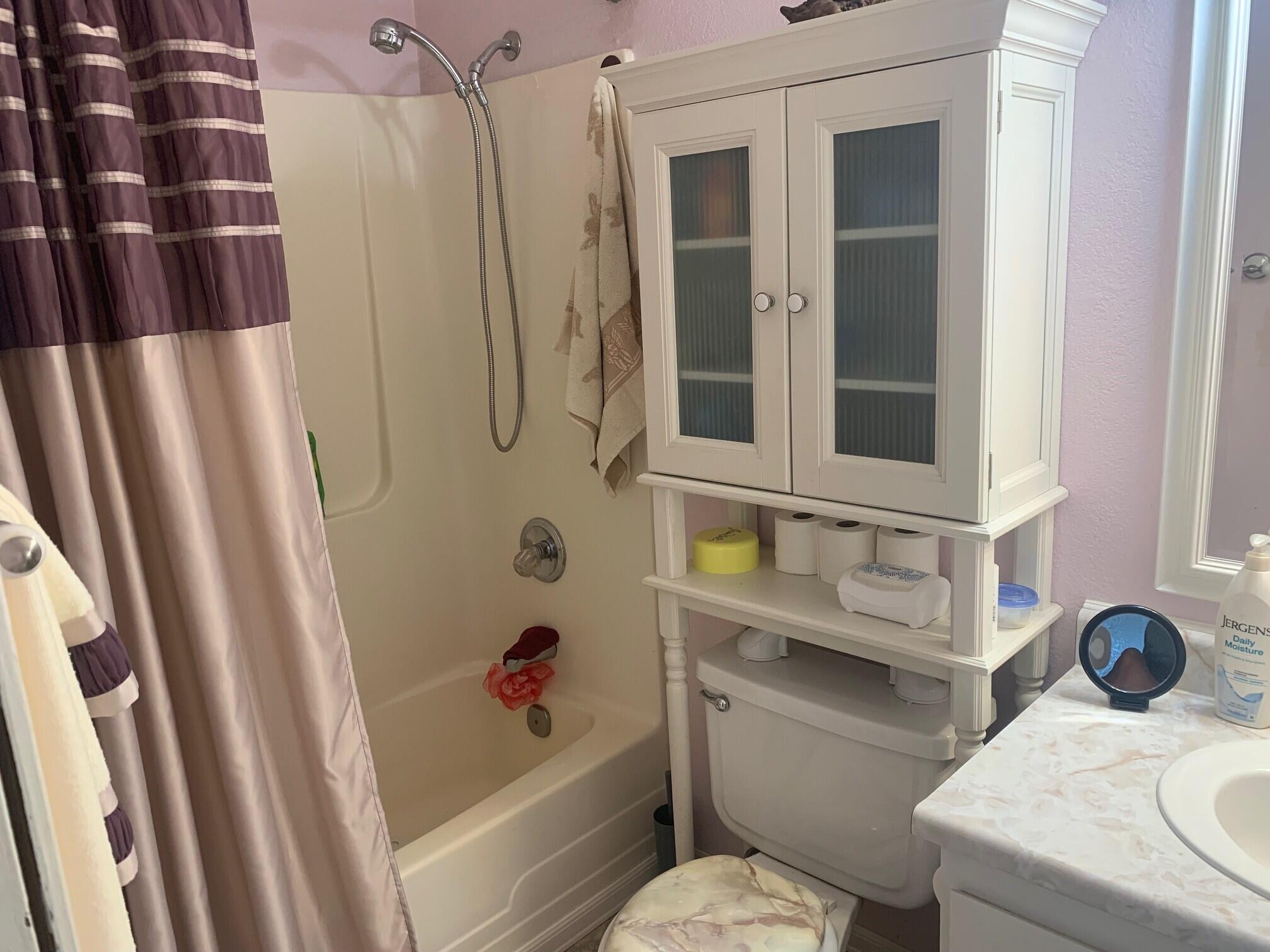 20604 Roff Way Burney, CA 96013 - Photo 23 of 32 a bathroom with a sink toilet and shower