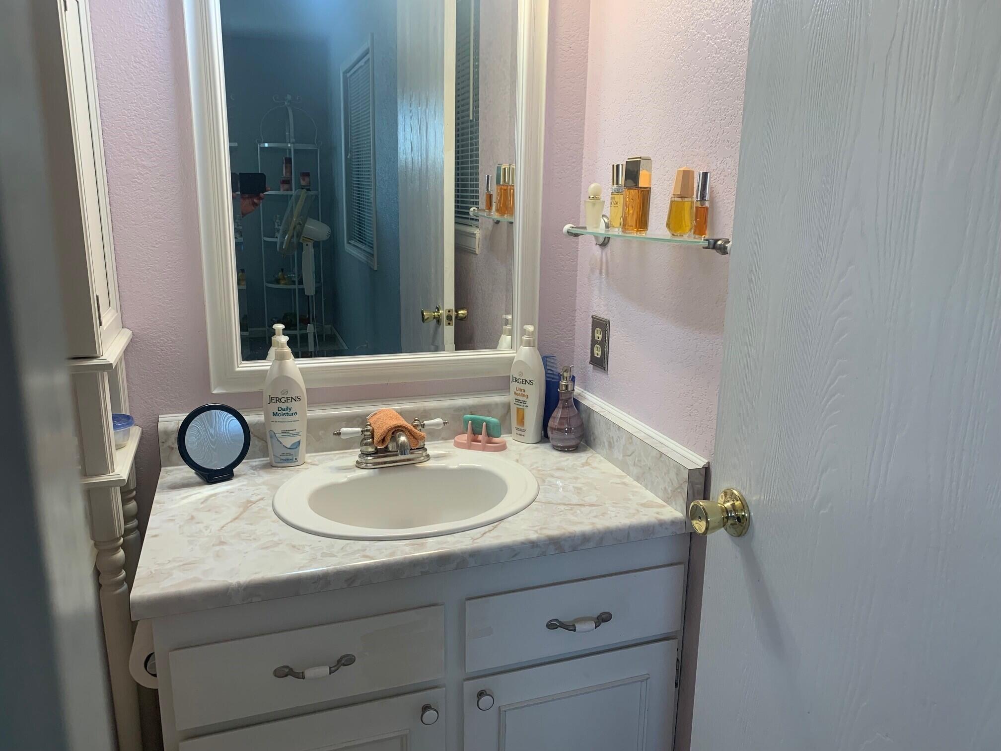 20604 Roff Way Burney, CA 96013 - Photo 24 of 32 a bathroom with a sink and a mirror