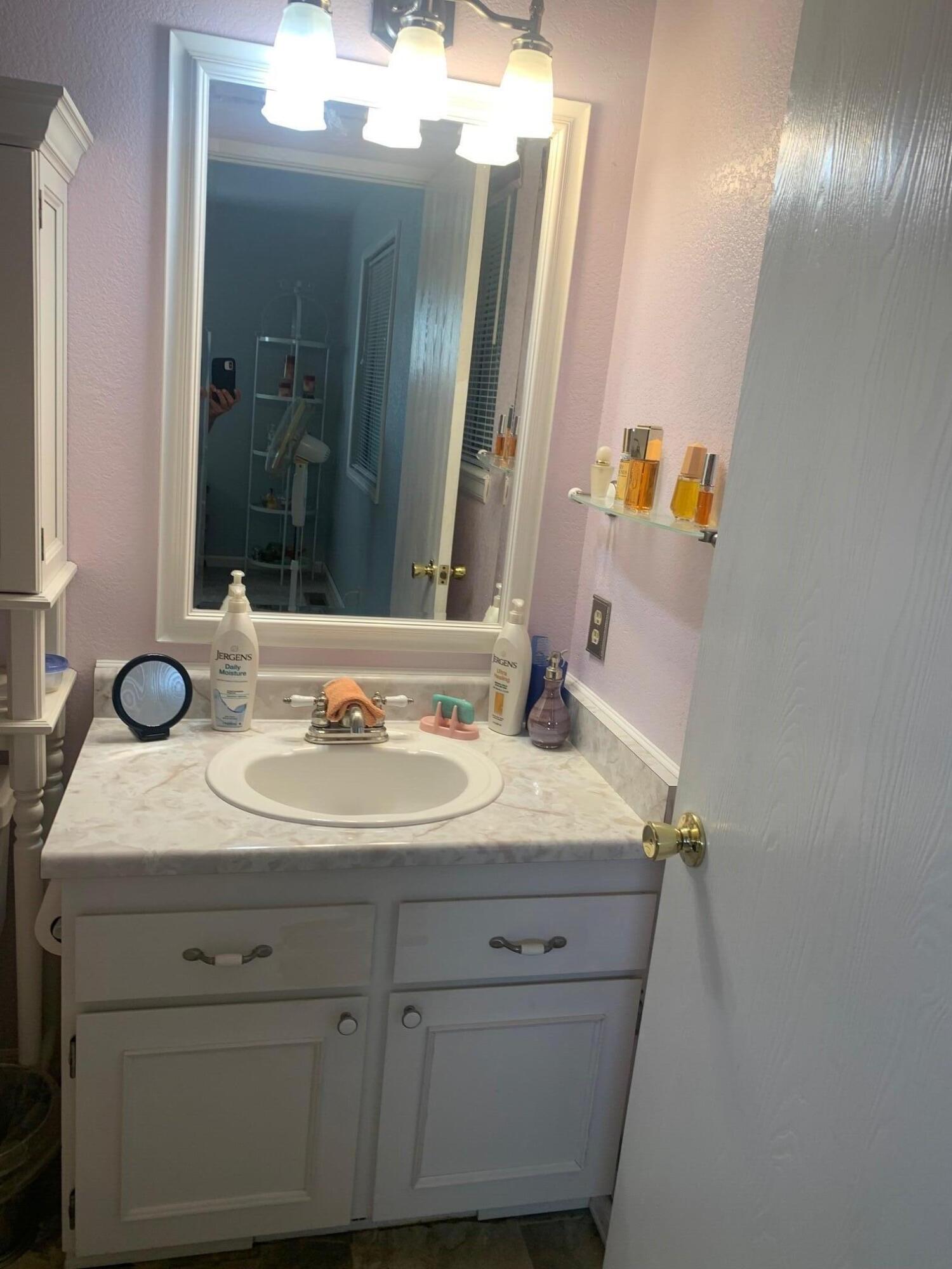 20604 Roff Way Burney, CA 96013 - Photo 25 of 32 a bathroom with a sink and a mirror