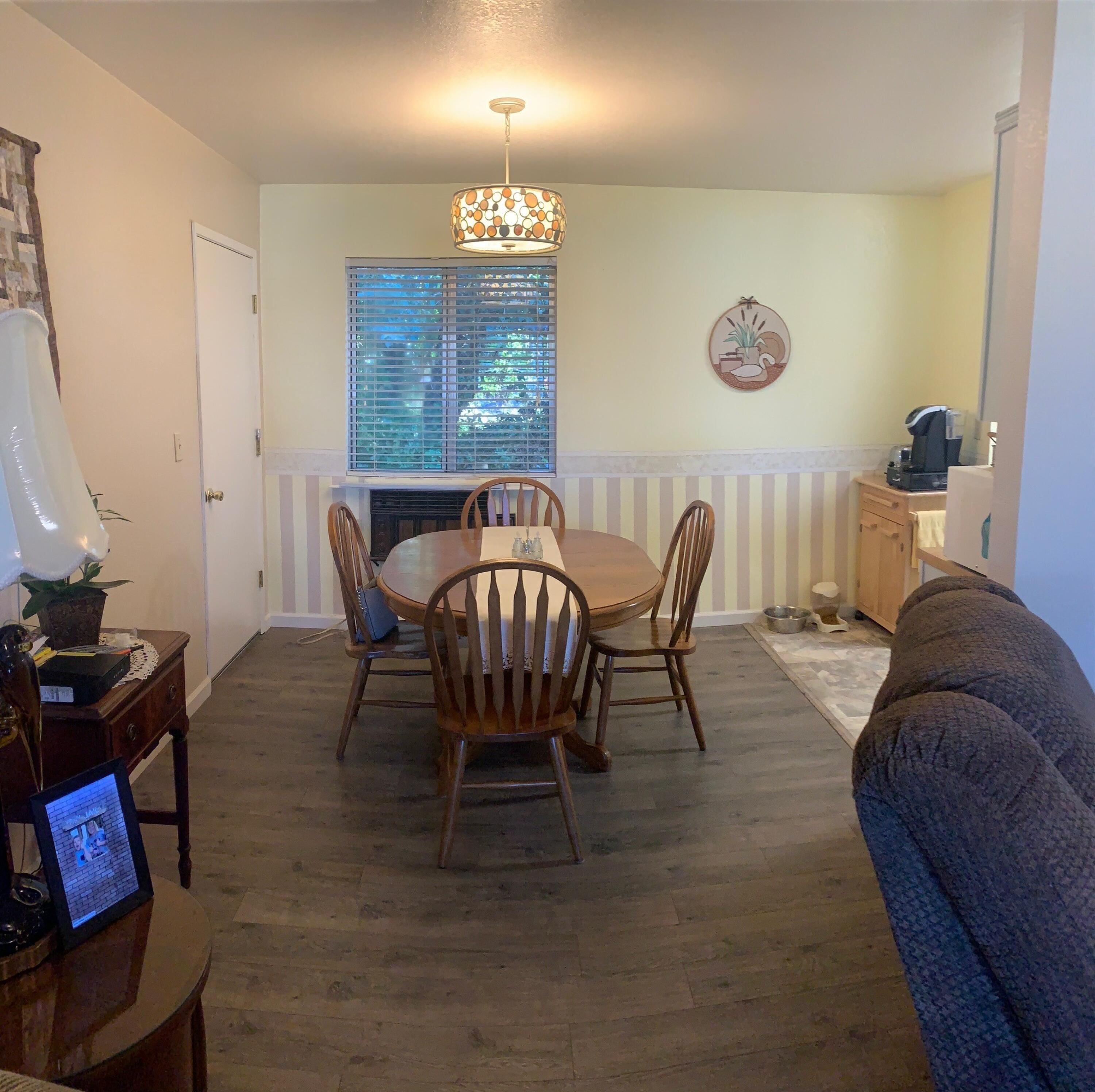 20604 Roff Way Burney, CA 96013 - Photo 4 of 32 a view of a dining room with furniture and chandelier