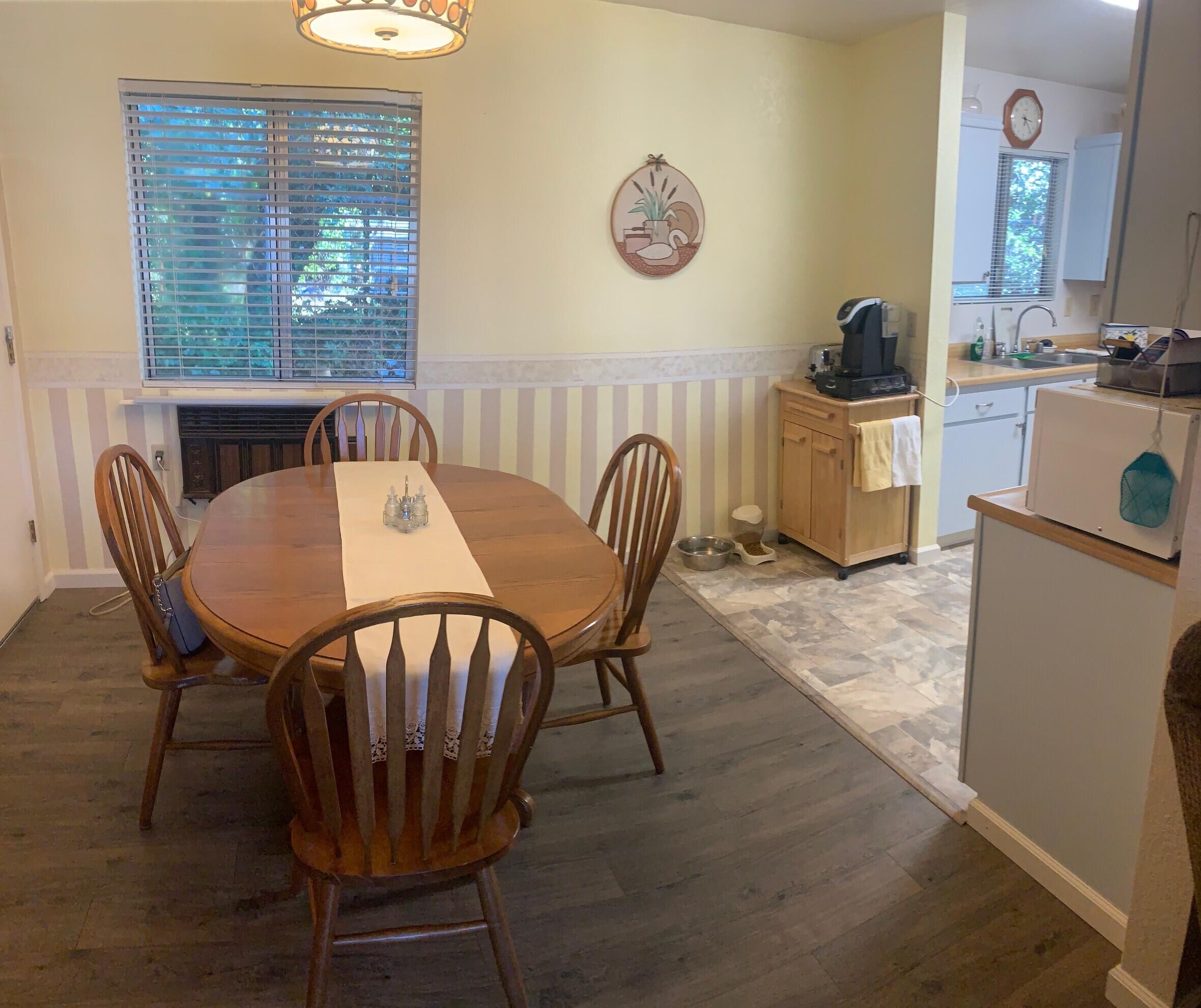 20604 Roff Way Burney, CA 96013 - Photo 7 of 32 a view of a dining room with furniture and window