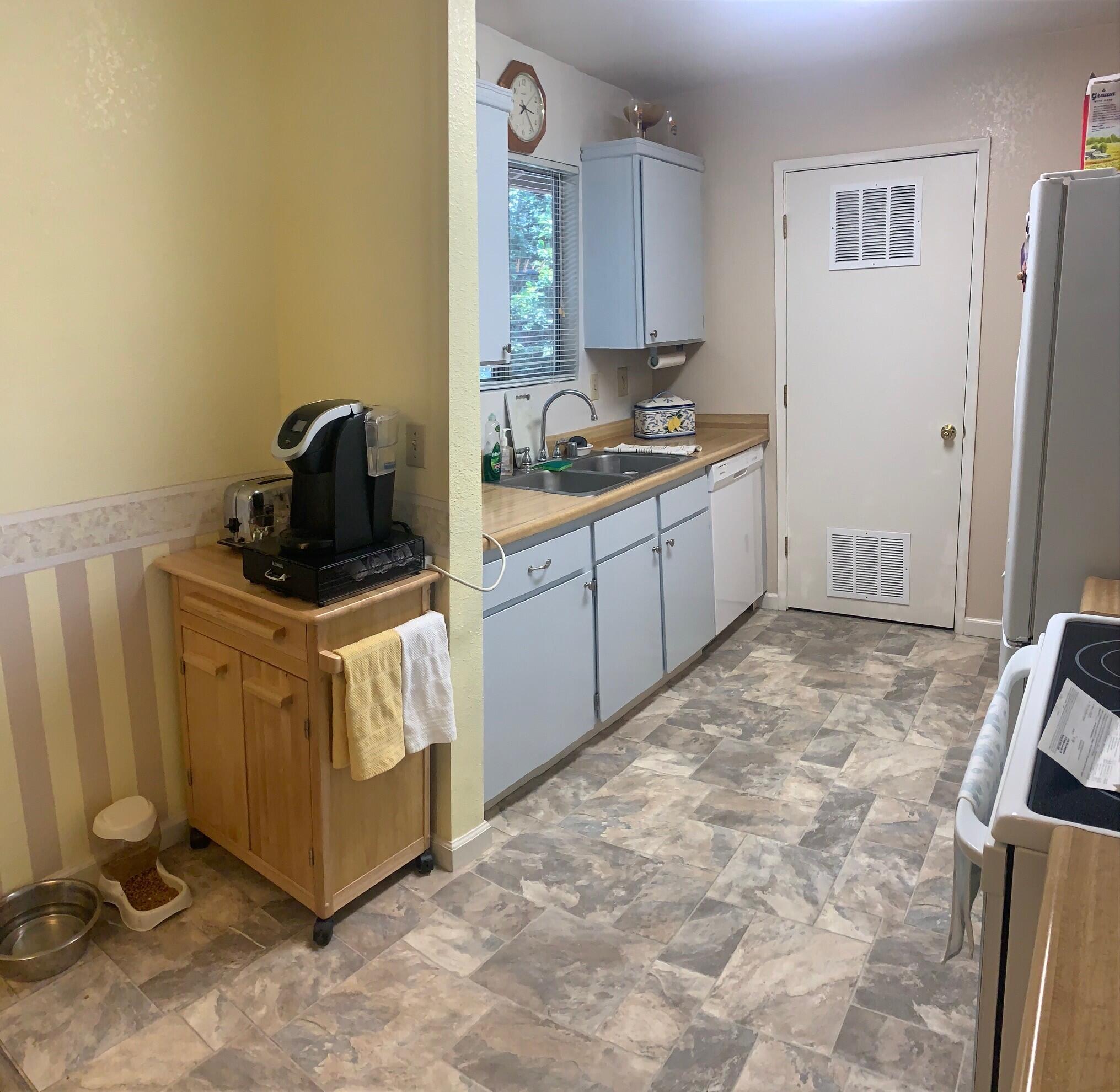 20604 Roff Way Burney, CA 96013 - Photo 8 of 32 a kitchen with a stove and a refrigerator