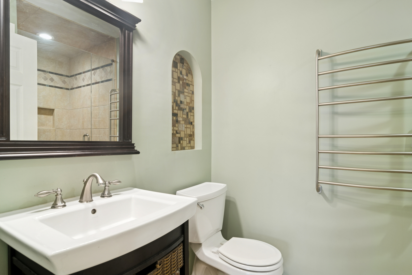 184 Grove Avenue, Unit B Des Plaines, IL 60016 - Photo 15 of 20 a bathroom with a sink mirror and toilet