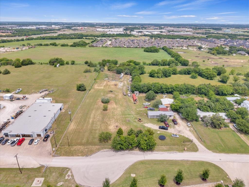 2511 Mathis Road Mansfield, TX 76063 - Photo 18 of 23 Land parcel featuring open fields, scattered mature trees, and a residential structure
