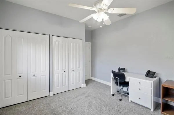 wooden floor and chandelier fan in a room