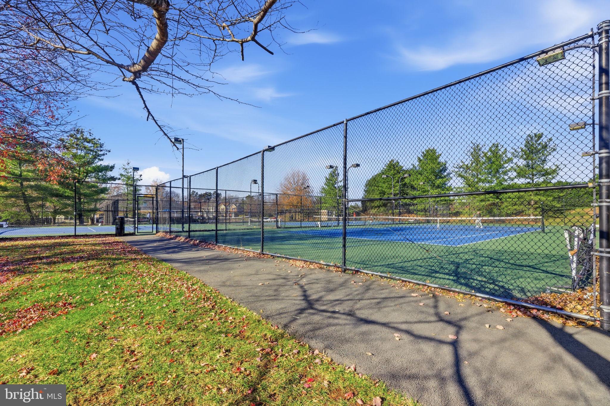 20963 Timber Ridge Terrace, Unit 103 Ashburn, VA 20147 - Photo 26 of 32 a view of a park with swings