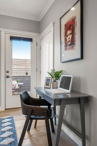 a view of a dining room with furniture and window