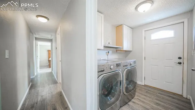 a view of a kitchen with washer and dryer
