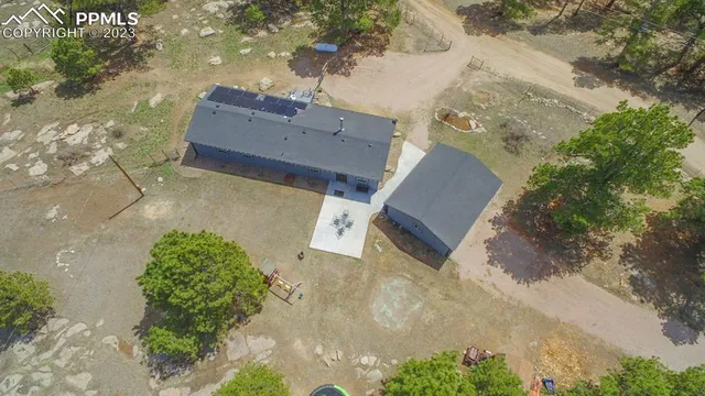 an aerial view of residential houses with outdoor space