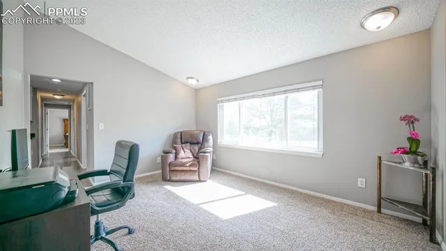 a workspace with furniture and a window