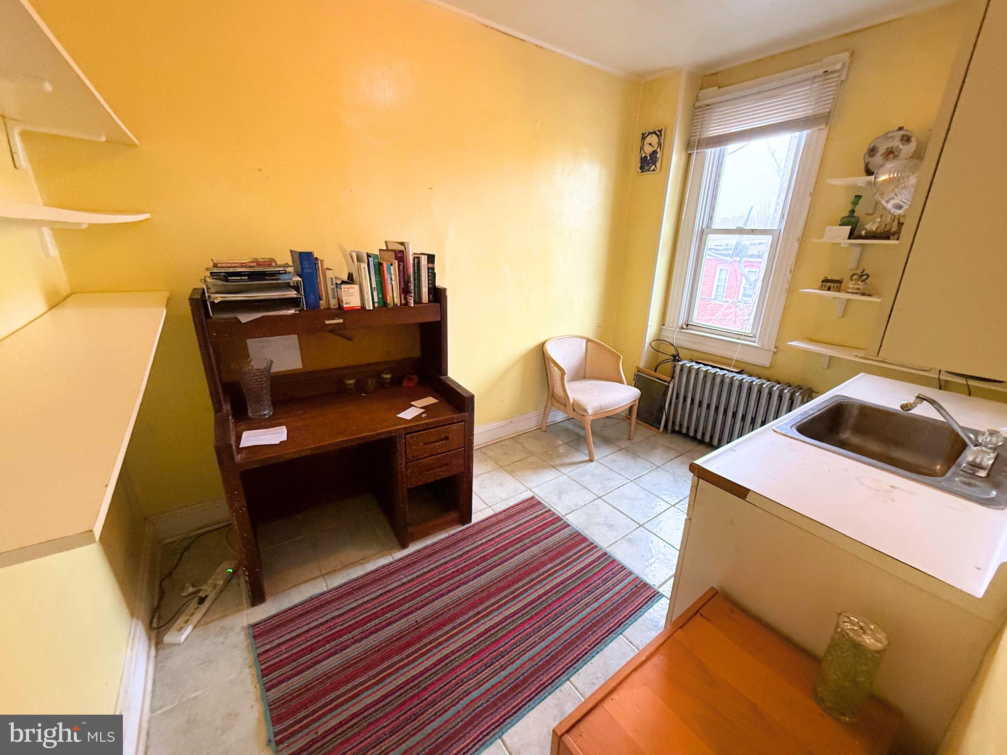 2680 St Benedict Street Baltimore, MD 21223 - Photo 14 of 27 a living room with furniture and wooden floor