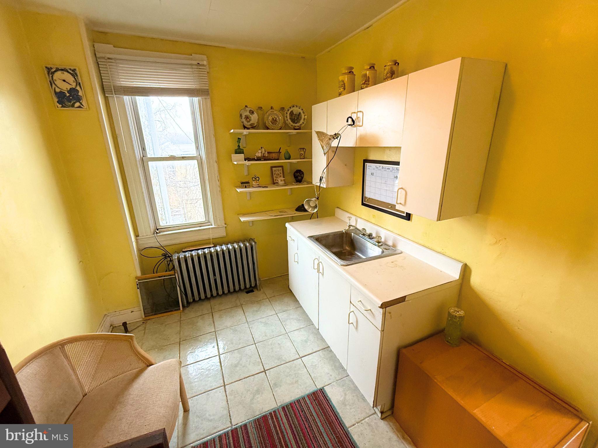 2680 St Benedict Street Baltimore, MD 21223 - Photo 15 of 27 a bathroom with a sink toilet and window