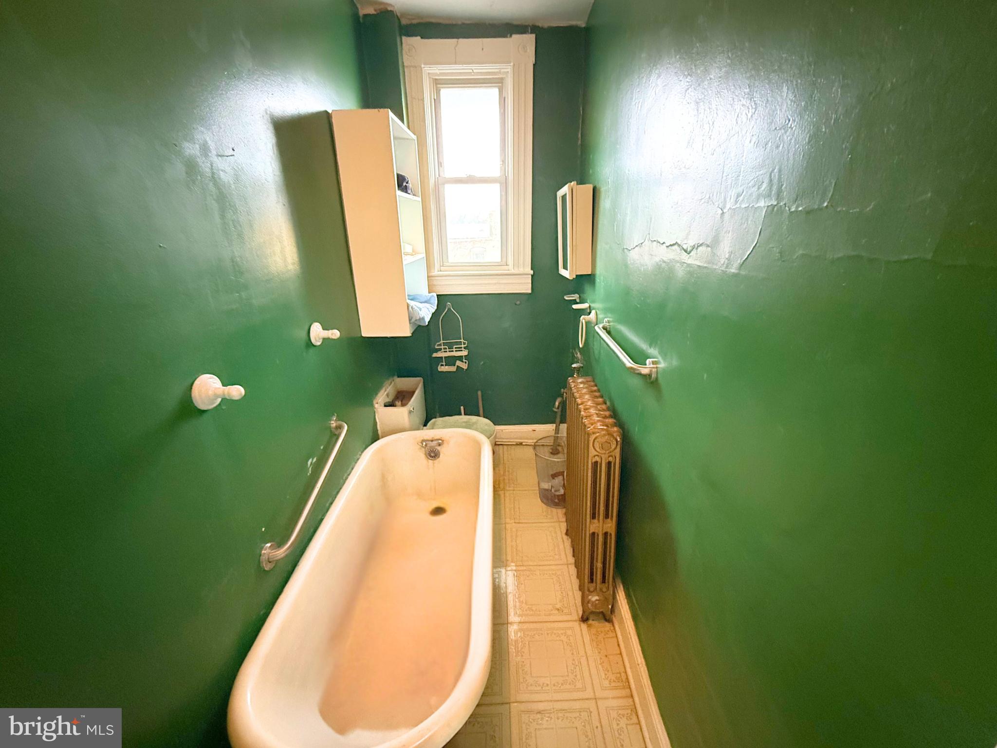 2680 St Benedict Street Baltimore, MD 21223 - Photo 16 of 27 a bathroom with a sink and mirror